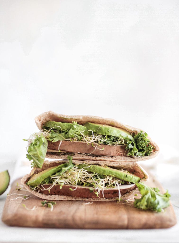 pita handheld with sprouts, avocado and portobello mushrooms
