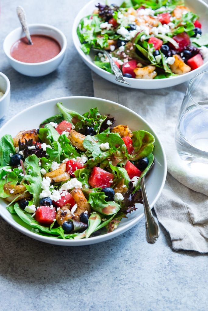 Healthy salad with fruit in a bowl on a table